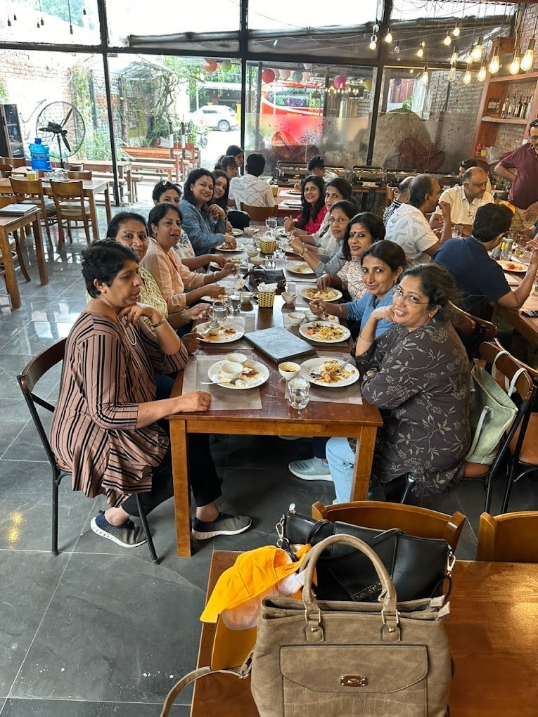 A group sharing an Indian meal at Kadhai